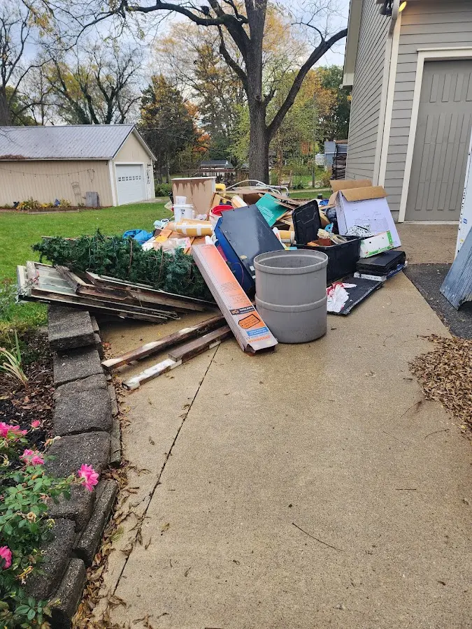 Dumpster being loaded with debris for Estate Cleanout Dumpster Rental in Schuylkill
